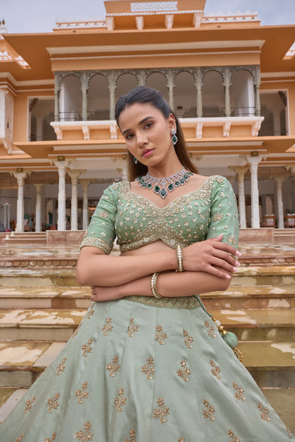 Paryushi green lehenga with organza dupatta