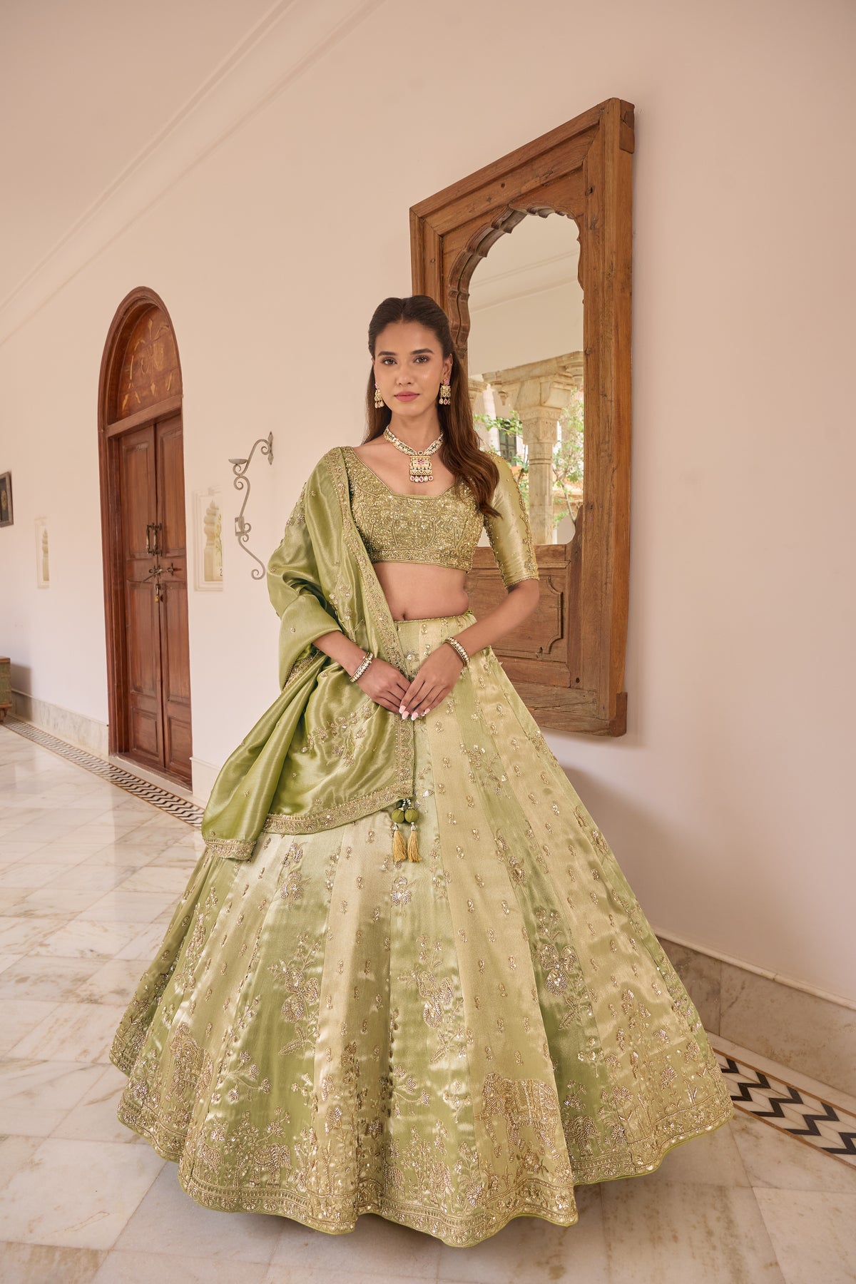 Pragnika lehenga with tissue dupatta draped across