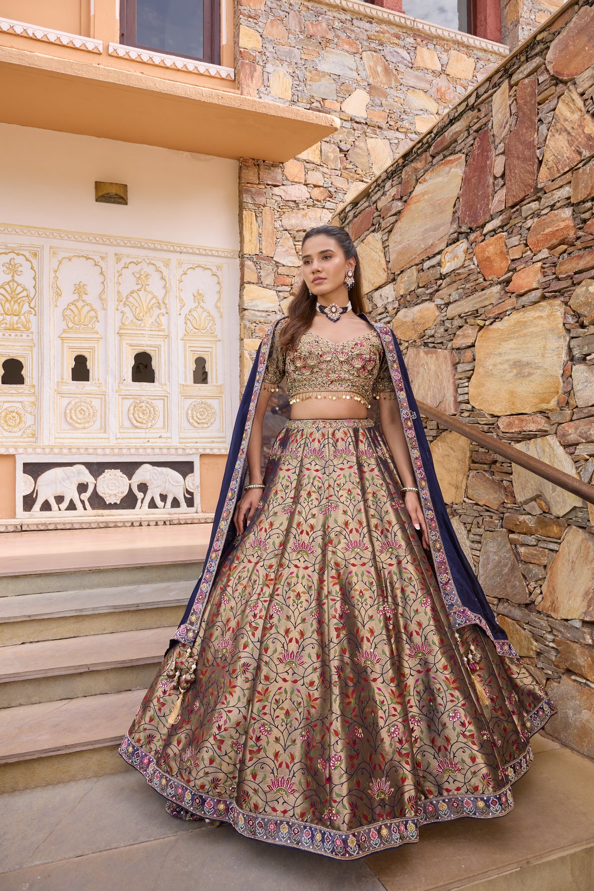 Priyah lehenga with navy dupatta over both shoulders